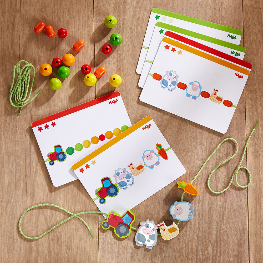 HABA Εκπαιδευτικό παιχνίδι λεπτής κινητικότητας με κορδόνι «η φάρμα»